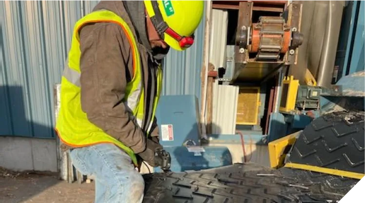 employee working on belt repair